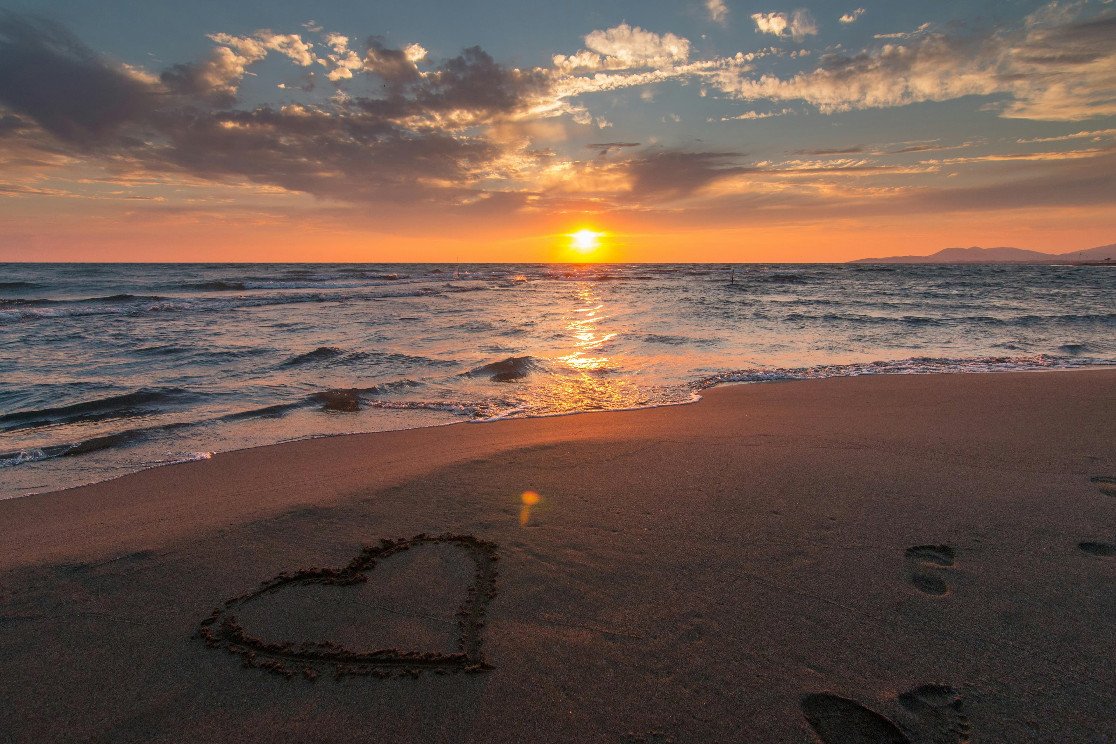 amor à praia e ao pôr do sol