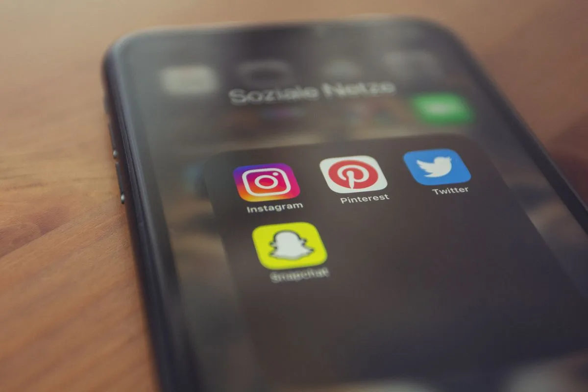 A smartphone screen showing Instagram alongside other social media apps